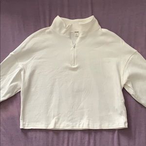 Cropped white quarter zip long sleeve shirt